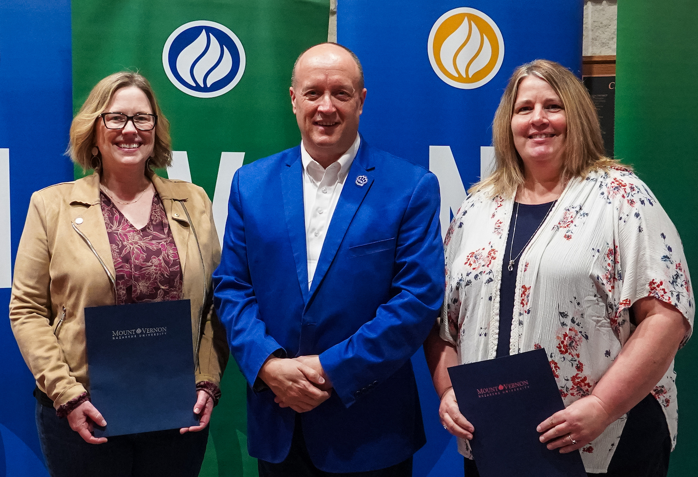 Mount Vernon Nazarene University President Dr. Carson Castleman, center, congratulates Excellence In the Call award recipients Dr. Carrie Beal, Biology Professor and Physical Sciences Department Chair, left; and Samantha Scoles, Communications Director, right.  