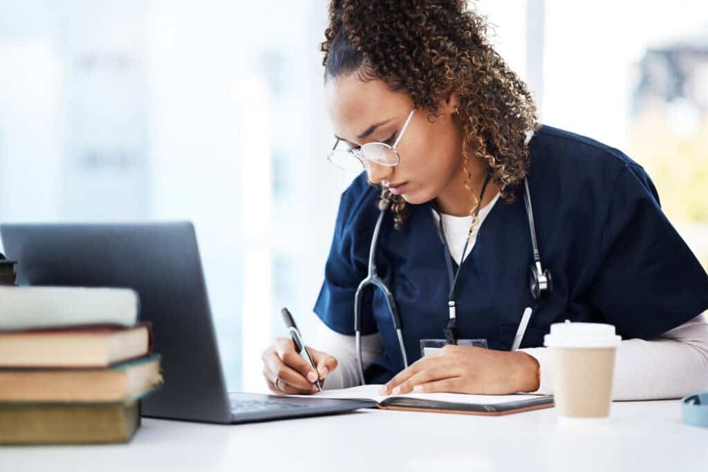 An online nursing student studying in a computer lab.