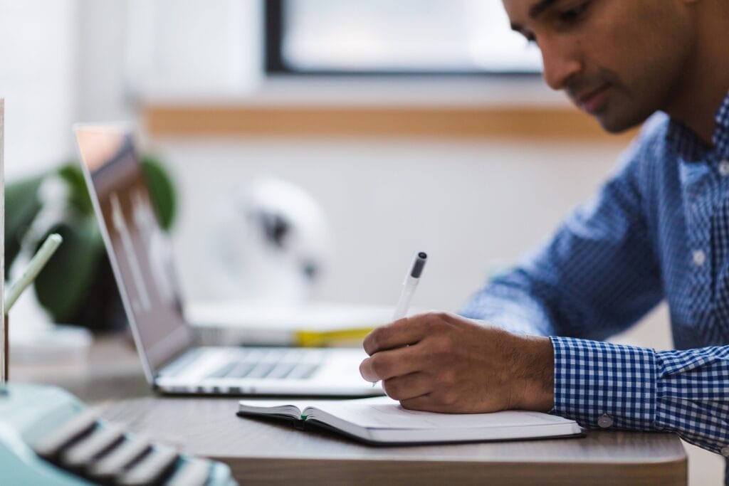 Man, Writing, Laptop image