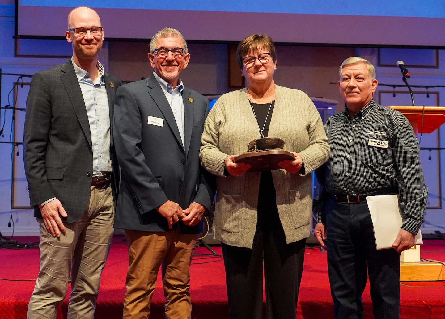 Howald Distinguished Alumni 23 Jeana Howald was presented the Distinguished Alumni Award by the MVNU Alumni Association during Homecoming Chapel on Nov. 10. Pictured, from left, are, Dr. James Smith, Vice President for University Relations; Mike Cheek, Executive Director of Alumni Relations and Advancement; Jeana Howald; and Ron Keiser, President MVNU Alumni Association.