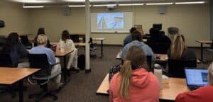 Mount Vernon Nazarene University Assistant Professor of Nursing Esther Rudolph, not shown, demonstrates the new SimX Virtual Reality software to one of her classes this semester. The software, when paired with a Meta Quest VR headset, is changing the way students prepare for real life situations in a classroom setting. (Photo courtesy of Mount Vernon Nazarene University)