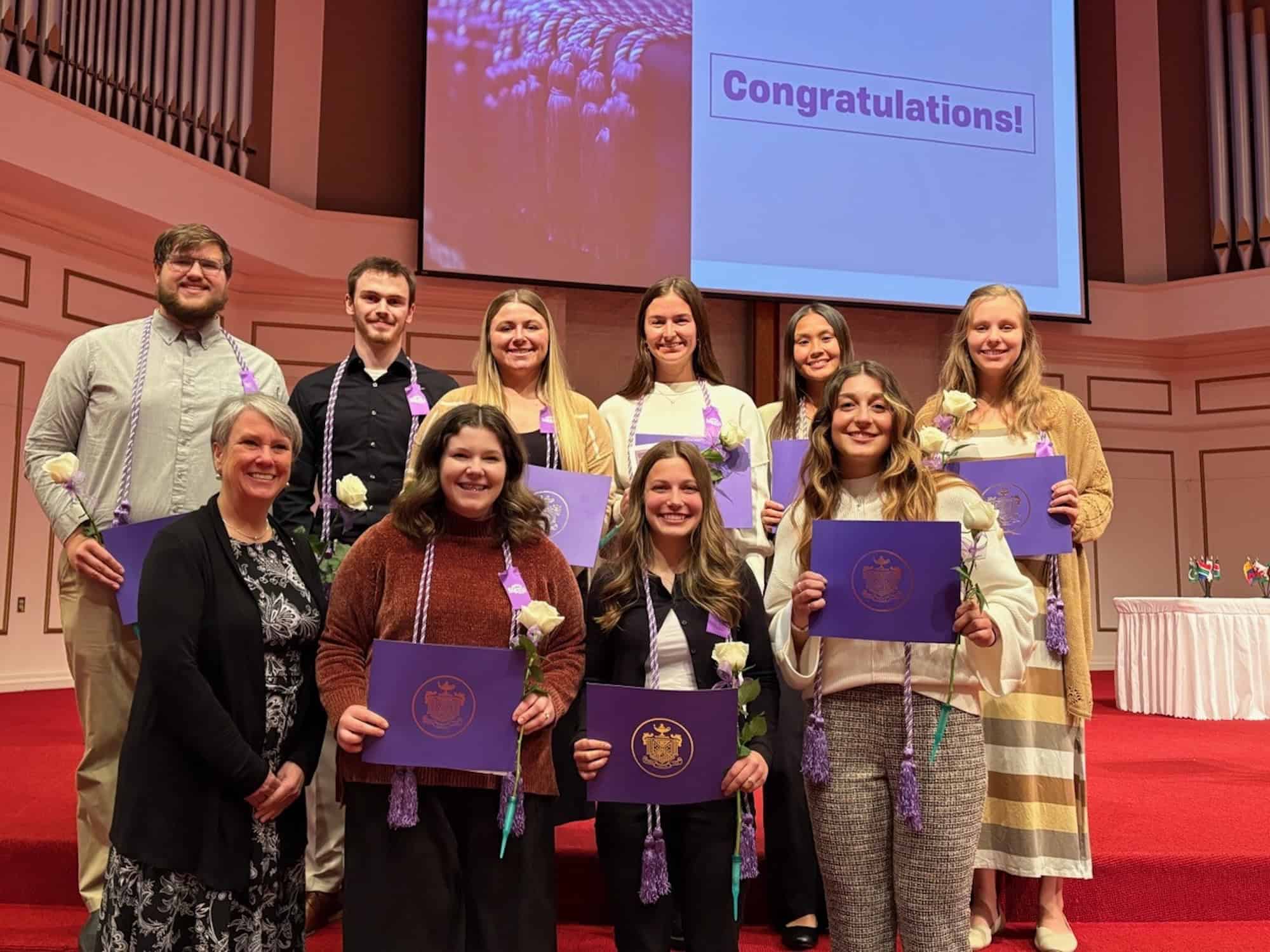 Nine MVNU students were inducted into theRho Nu at-Large Chapter of Sigma Theta Tau International Honor Society of Nursing during a recent ceremony. Pictured in the front row, from left, are: Dr. Judy Gregg, Alivia Schmink, Emma Dillinger, and Ashley Merrick. In the back row, from left, are: Ethan Byrom, Hayden Salyers, Kennady Ruhl, Brooke Frazier, Jaelyn Tang, and Leah White. (Photo courtesy of Mount Vernon Nazarene University)