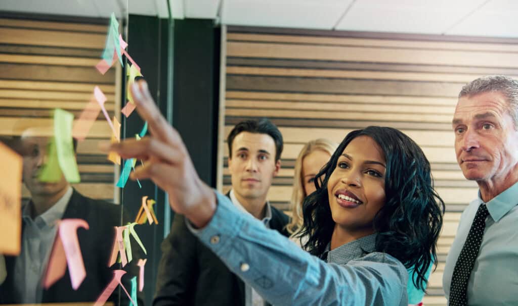 Business professionals collaborating in a modern office—representing the many career paths in organizational leadership. MVNU’s online degree programs prepare students for success in leadership roles across industries.