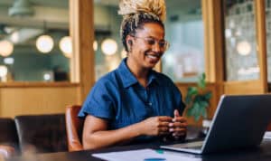 Working adult studying online, illustrating how long it can take to finish an online degree and how MVNU Online’s one class at a time format fits busy lives.