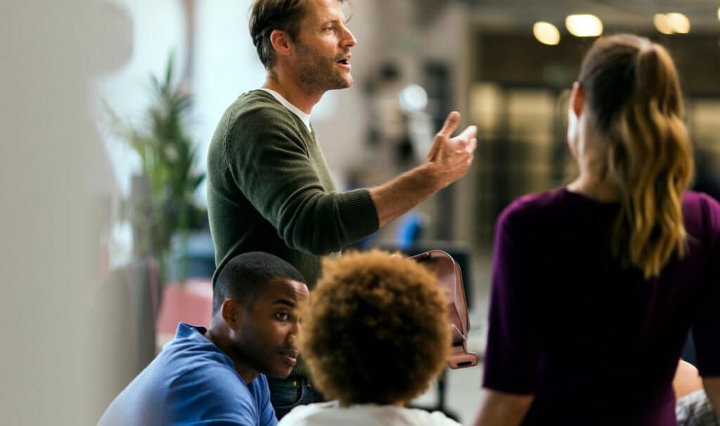 Pastor leading a group of parishioners, reflecting how MVNU Online’s Master of Ministry degree prepares leaders to serve churches and communities with faith and purpose.