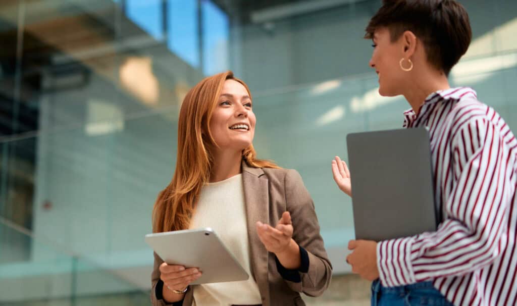 Two professionals discussing career advancement and leadership opportunities, reflecting how the right online degree from MVNU can support long-term career growth.