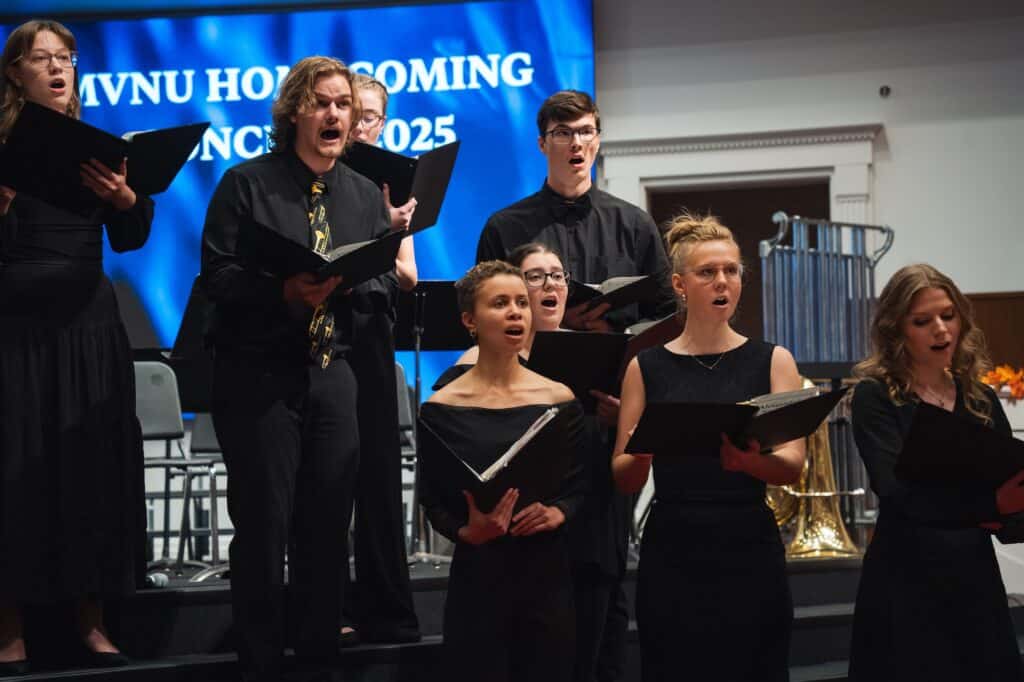 MVNU choir performing on stage during a concert.