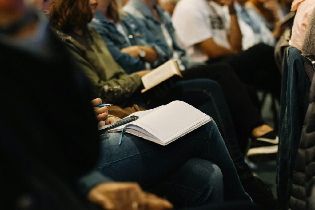 Adult students taking notes during a lecture representing MVNU online Christian ministry degree for Cincinnati Ohio learners