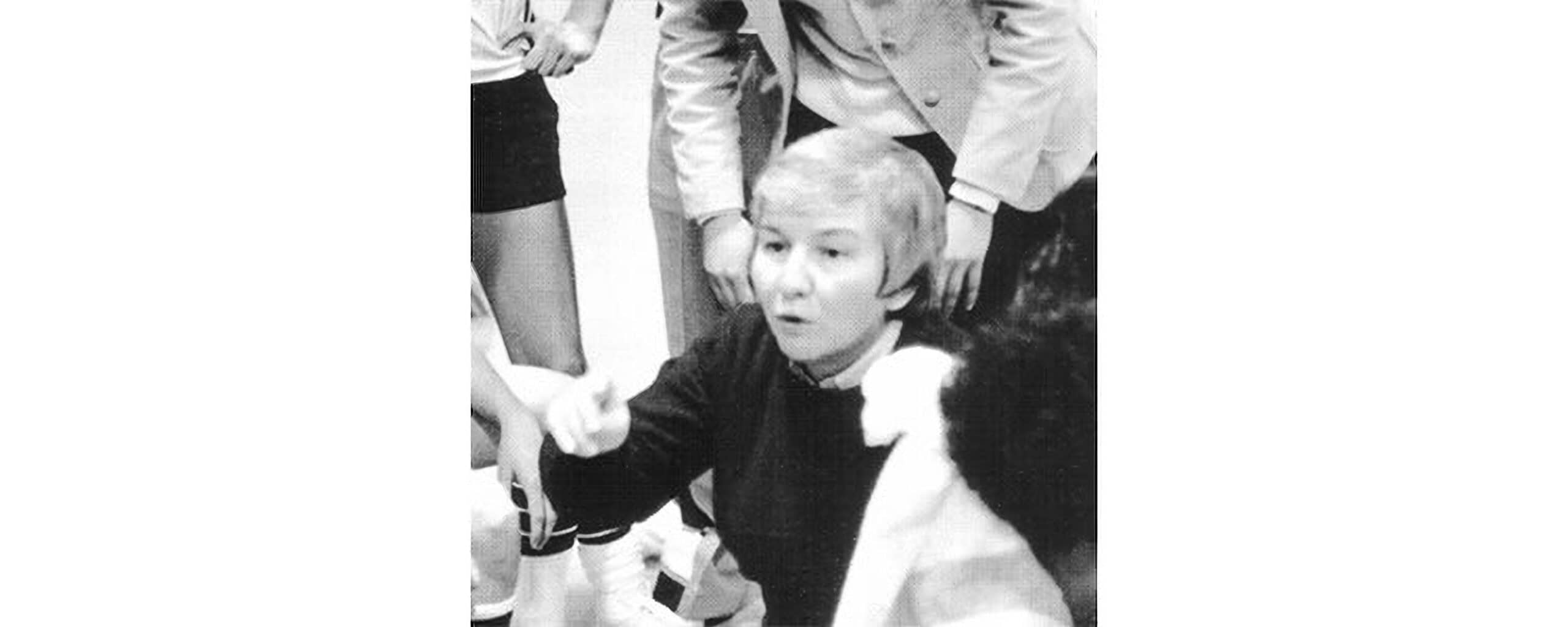 Young boy speaking passionately with adults around him, inspiring leadership.