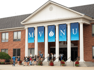 Students entering MVMU campus for new student orientation event.