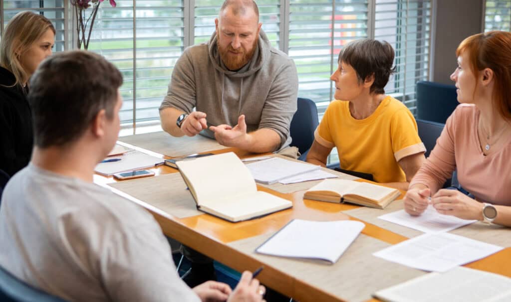 An MVNU Online graduate leads a faith-based discussion group, reflecting how faith-integrated coursework prepares students to guide others