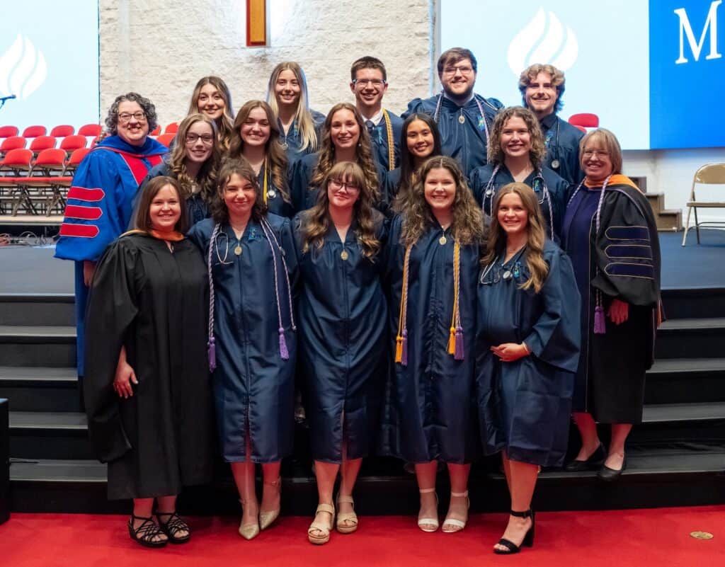 MVNU nursing graduates in caps and gowns at graduation ceremony.