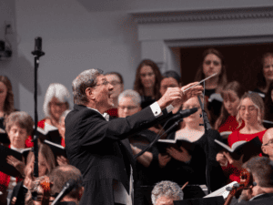 Conductor leading a choir during Handel’s Messiah performance at MVNU.