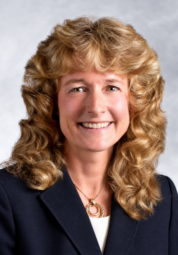 Portrait of Dr. Kimberly K. Loscko, DVM smiling in professional attire.